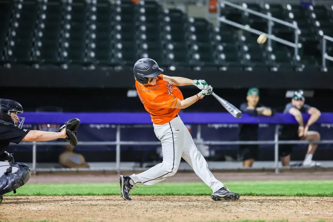 Student playing baseball.